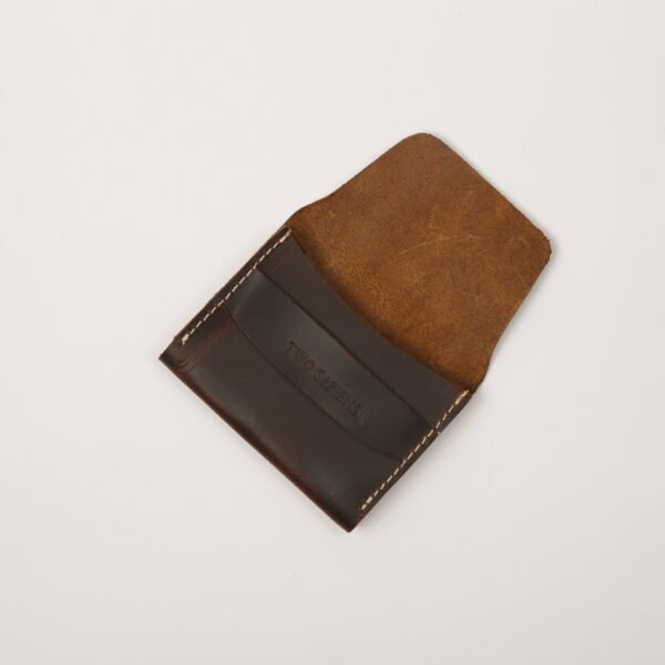Dark brown leather card wallet closed on white background – Two Sapiens branding embossed