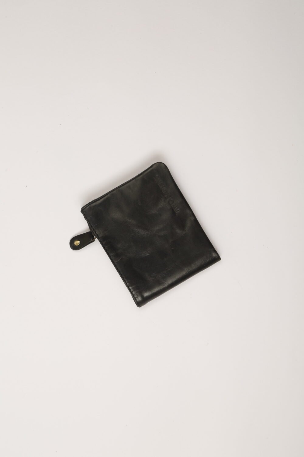 Black leather bifold wallet with card slots, zipper compartment and brass snap buttons – handmade by Two Sapiens